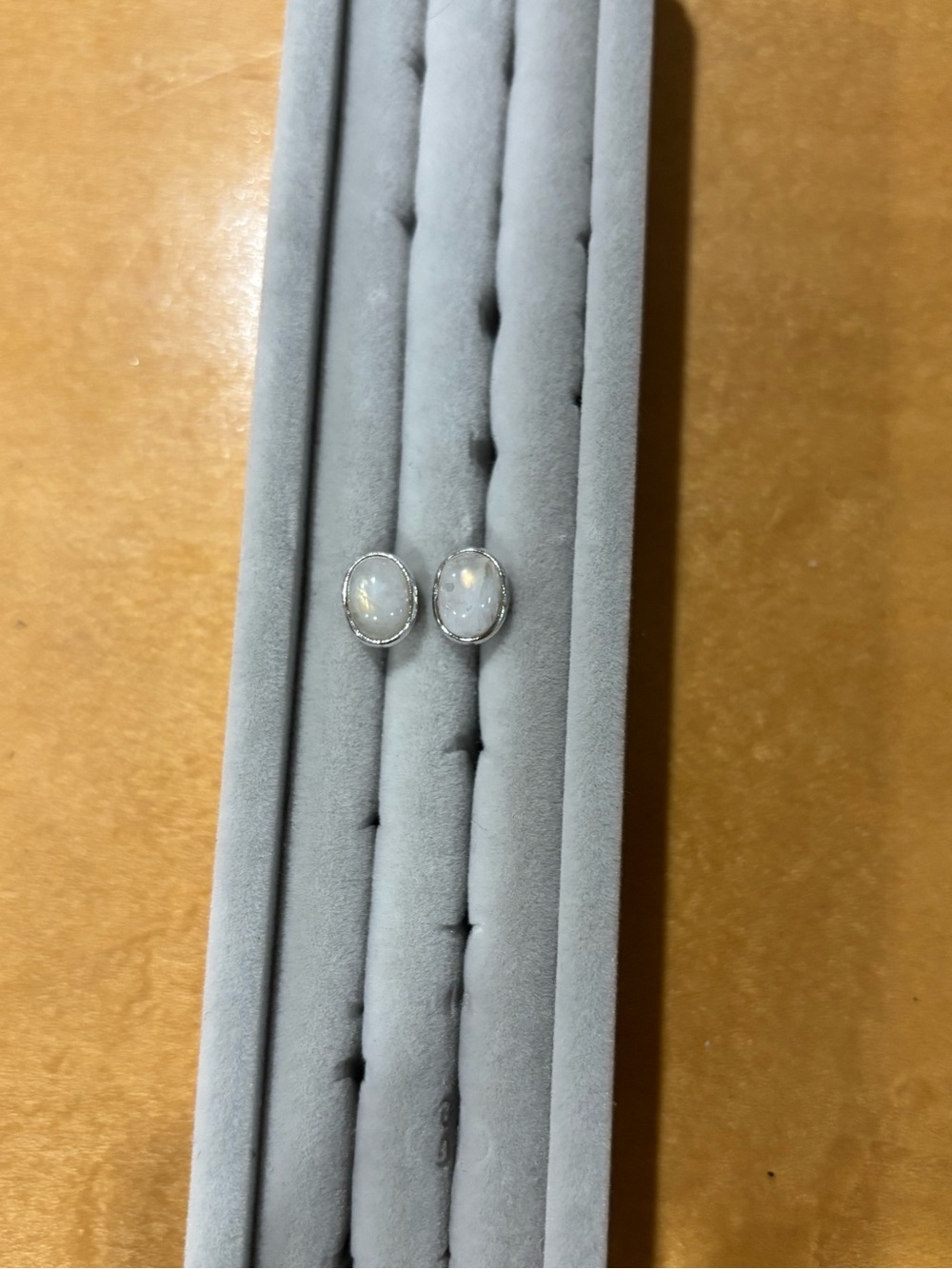 White quartz studs set in sterling silver